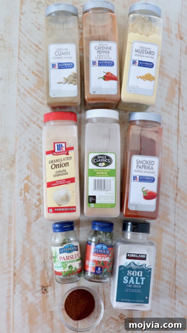 ingredients for southwest seasoning on white wood board