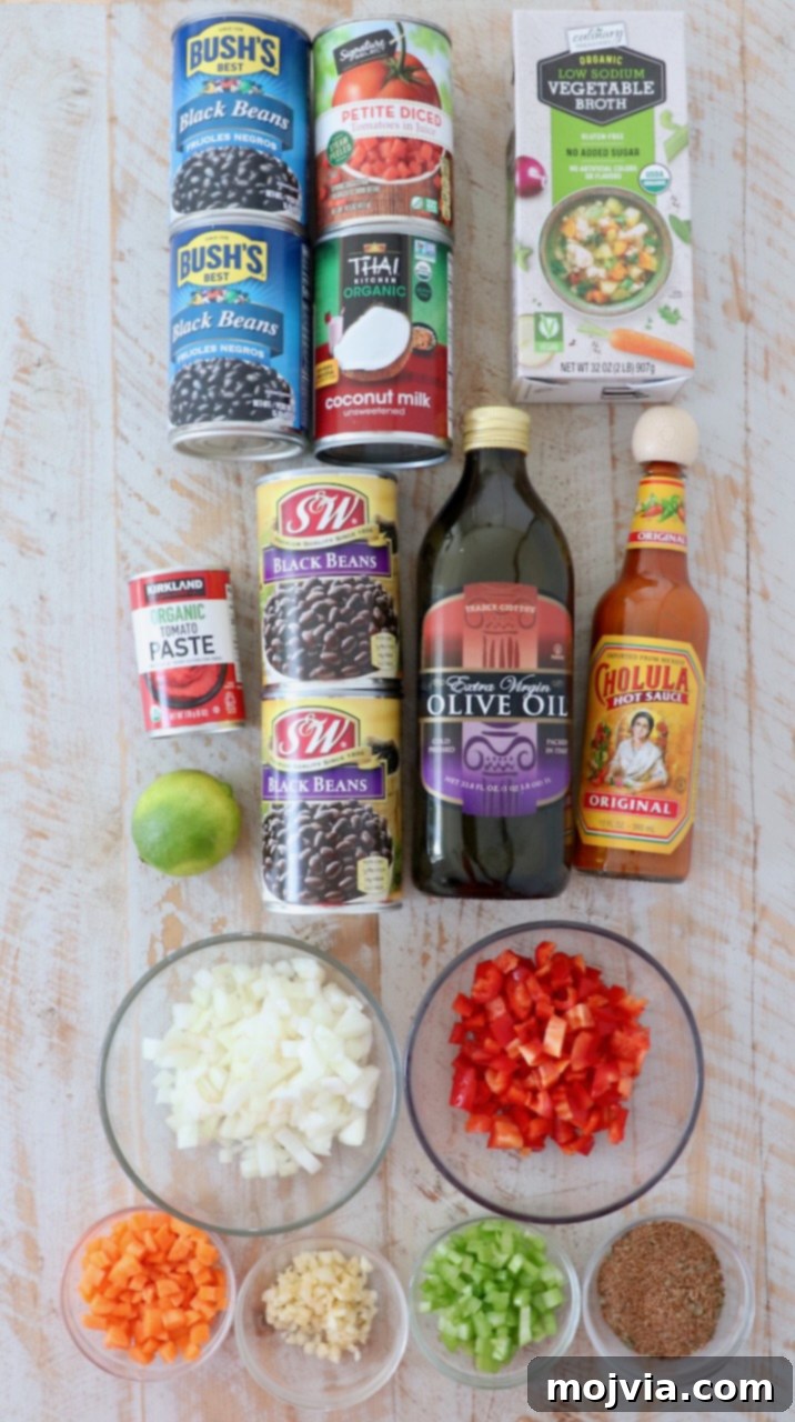 Zesty Southwest Black Bean Soup 3 ingredients for black bean soup on white wood board