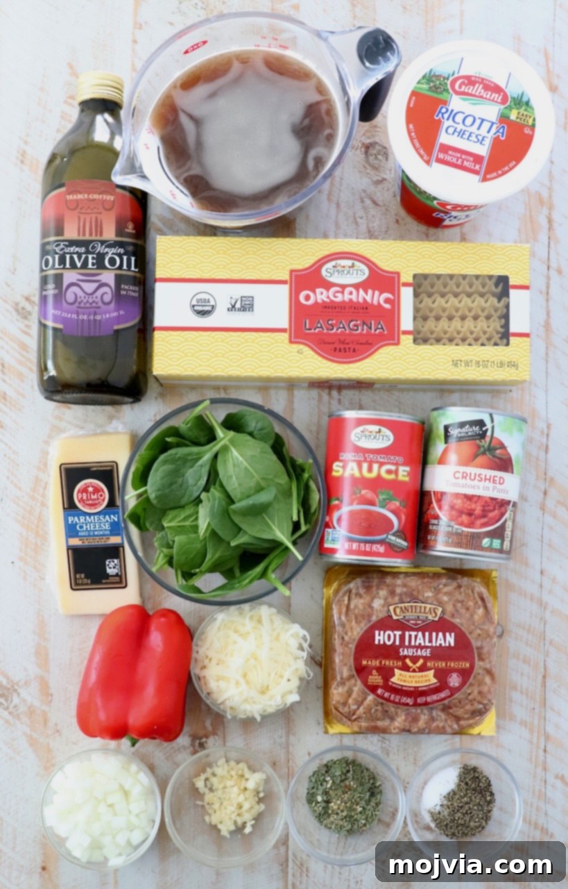 Hearty Lasagna Soup 3 ingredients for lasagna soup on white wood board