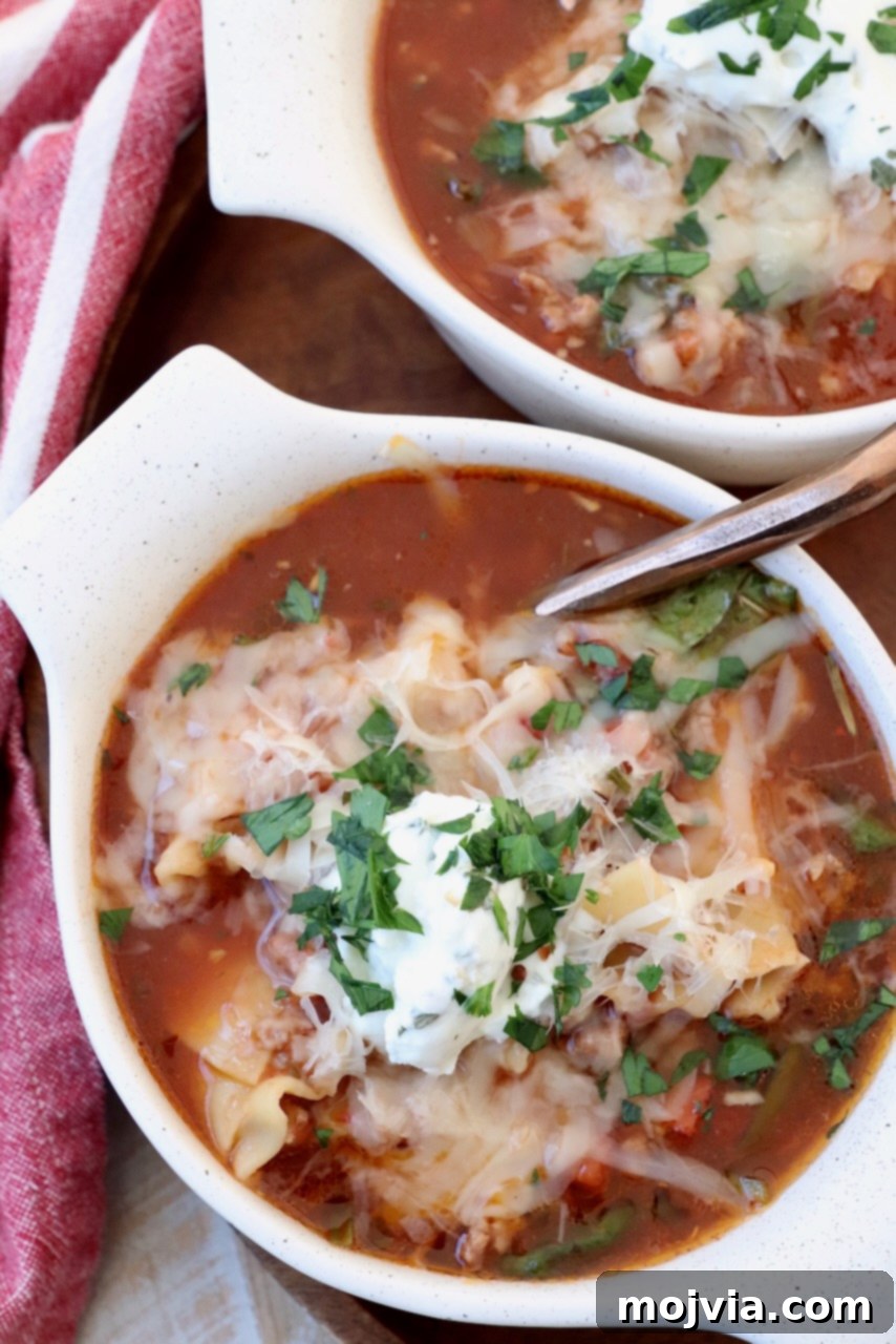 Hearty Lasagna Soup 10 lasagna soup in bowls with spoon