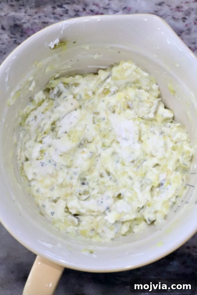 cream cheese and relish combined in a mixing bowl