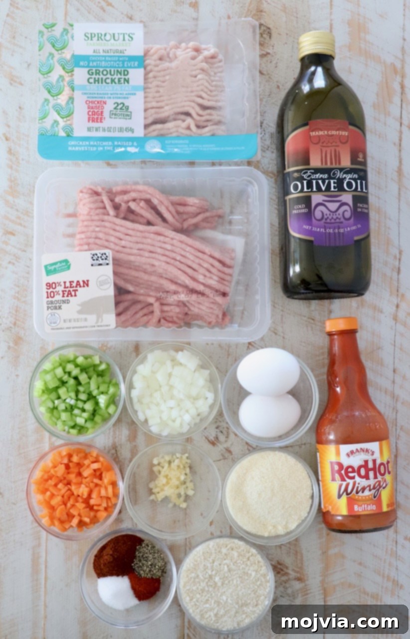 Zesty Buffalo Chicken Poppers 3 Ingredients for buffalo chicken meatballs laid out on a white wooden board