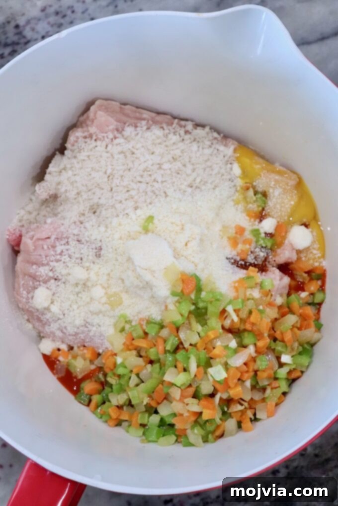 Zesty Buffalo Chicken Poppers 5 All ingredients for buffalo chicken meatballs in a large mixing bowl before combining