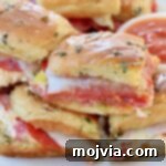 Hot Italian sliders stacked up on plate