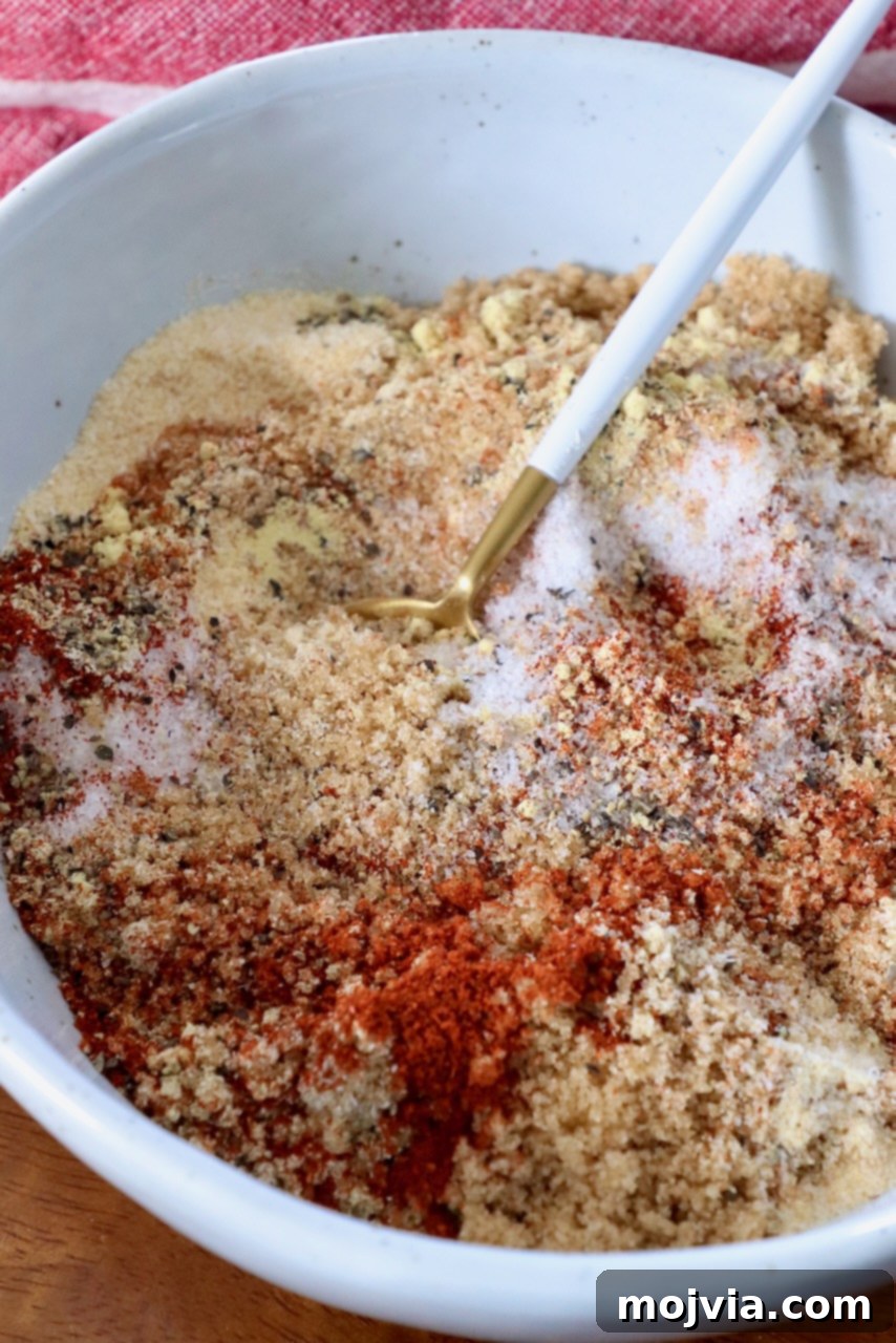 brown sugar and spices mixed together in a bowl, ready to be used as a dry rub for ribs