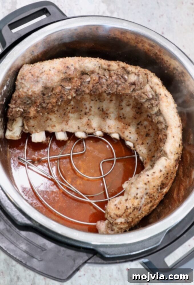 Fall Off The Bone Instant Pot Ribs 6 cooked rack of baby back ribs in Instant Pot