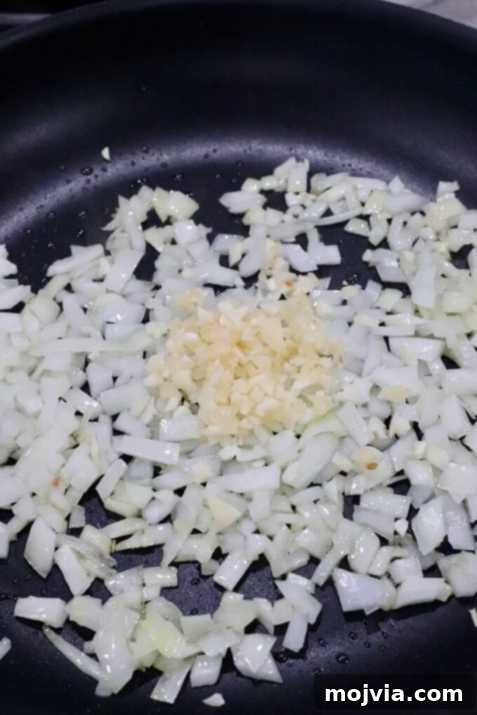 diced onions and minced garlic in a skillet