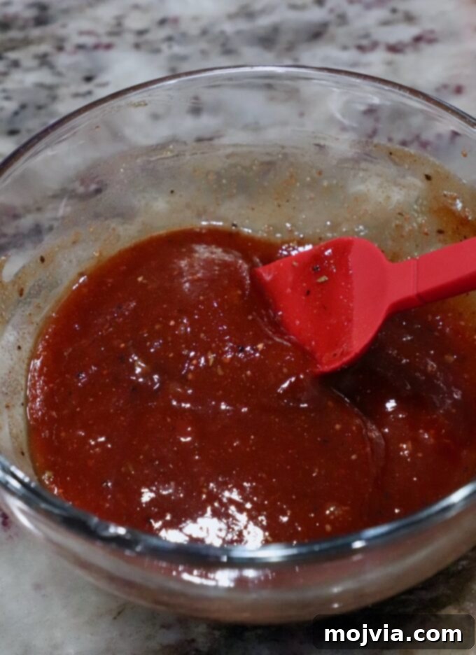 bbq sauce in bowl with pastry brush