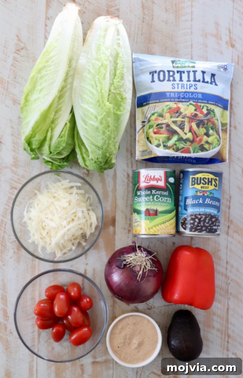 Vibrant Southwest Salad 3 ingredients for southwest salad on white wood board