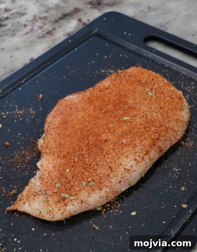 Vibrant Southwest Salad 6 seasoned chicken breast on cutting board