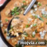 Bold Buffalo Chicken Soup 11 buffalo chicken meatball soup in skillet with spoon