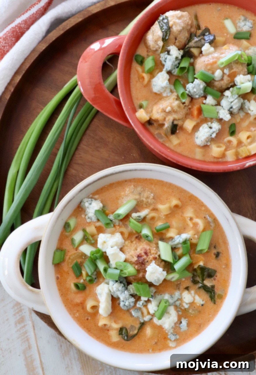 Bold Buffalo Chicken Soup 10 A bowl of buffalo chicken soup garnished with finely chopped green onions, ready to be enjoyed.