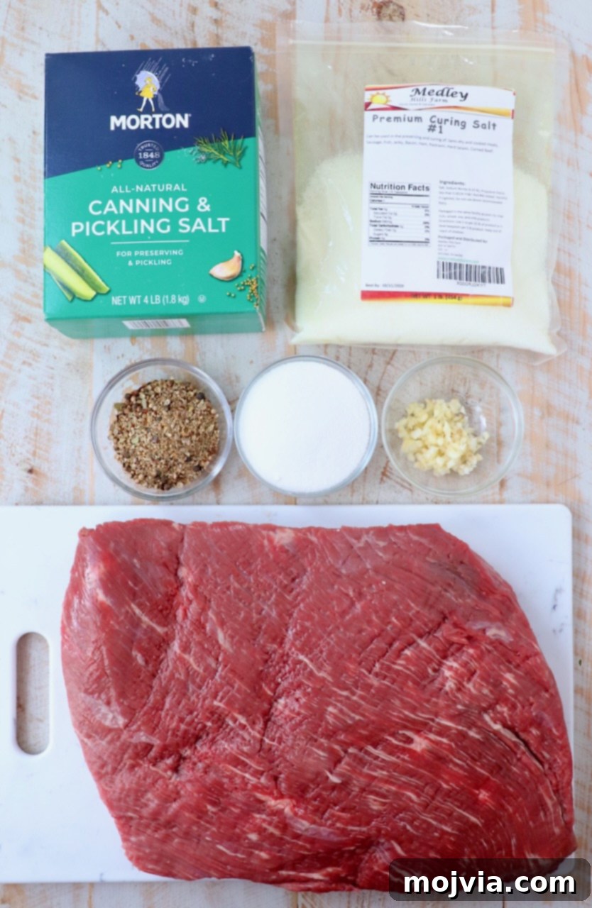 ingredients for homemade corned beef on white wood board