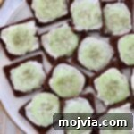 Open-faced cucumber tea sandwiches on a plate