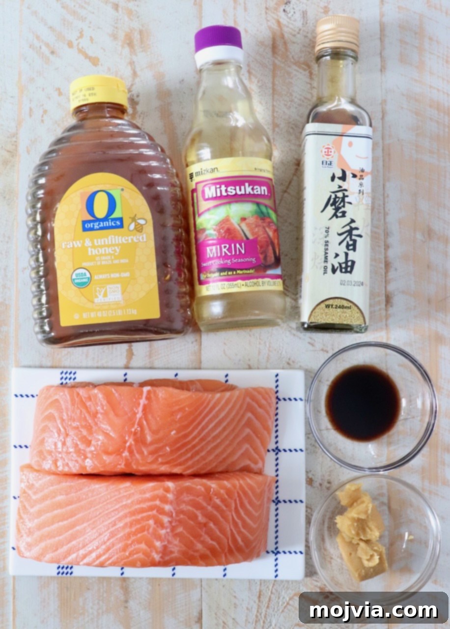 Golden Glazed Miso Salmon 3 ingredients for miso glazed salmon on white wood board