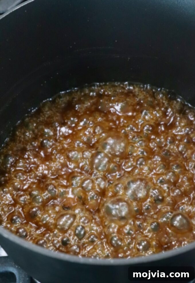 Golden Glazed Miso Salmon 5 miso glaze bubbling in pot on the stove
