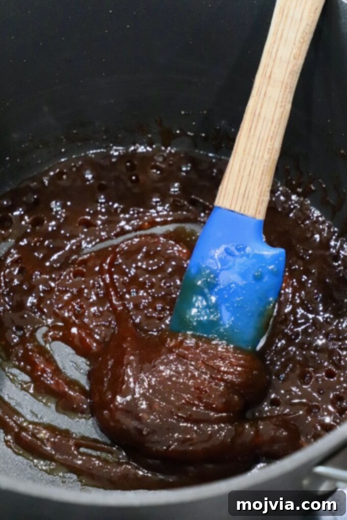 Golden Glazed Miso Salmon 6 thick miso glaze in pot with spatula