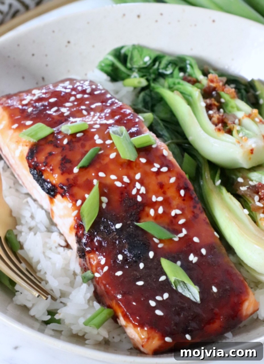 Golden Glazed Miso Salmon 8 miso glazed salmon filet in bowl with white rice and bok choy