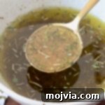 Italian dressing in bowl and spoon