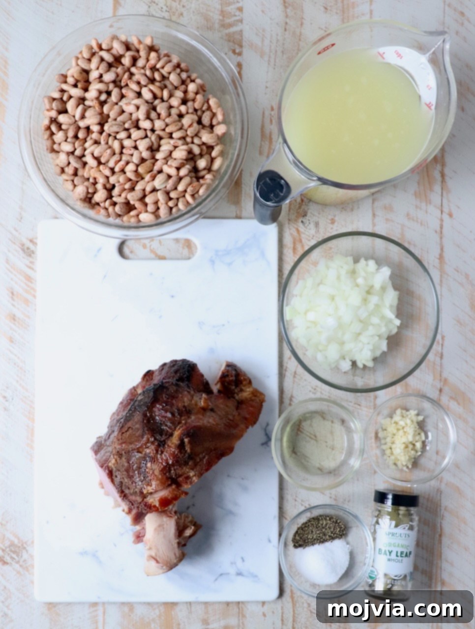 The Humble Pinto: A Culinary Staple 3 ingredients for pinto beans on white wood board