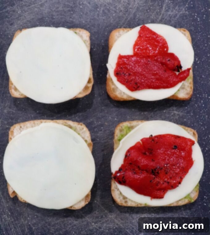 Herbed Turkey Pesto Stack 5 Juicy roasted red peppers carefully placed atop slices of provolone cheese on ciabatta rolls, adding a sweet and smoky layer.