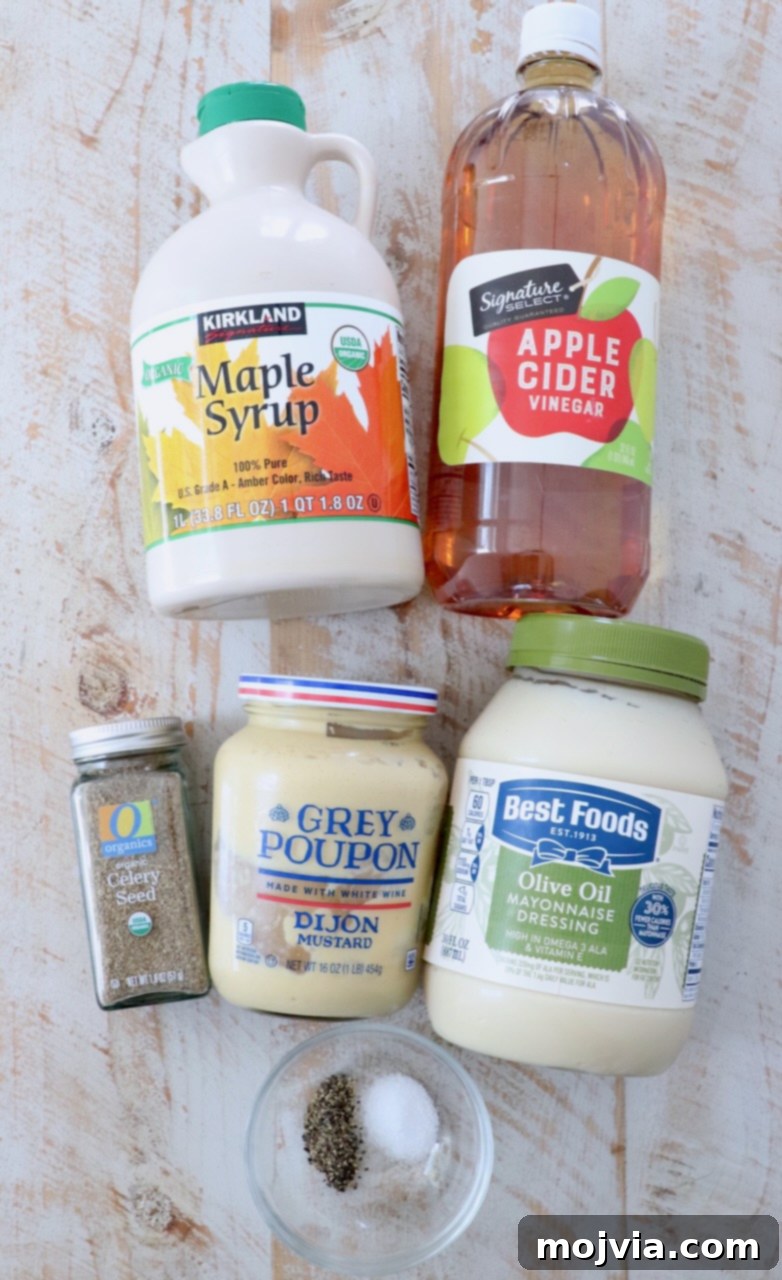 Zesty Coleslaw Dressing 3 Ingredients for coleslaw dressing laid out on a white wooden board