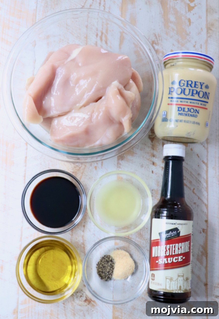 Tender Chicken Elixir 3 All seven ingredients for the chicken marinade laid out on a white wooden board, ready for mixing.