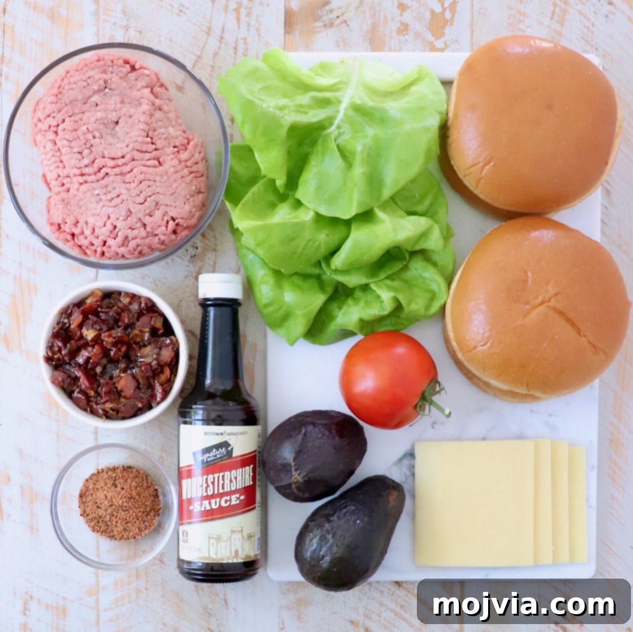 California Dream Burger 3 Ingredients laid out for making California burgers on a white wooden surface