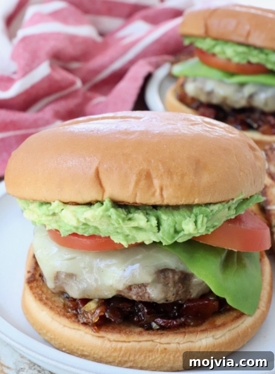 California Dream Burger 9 Close-up of a California Burger showing smashed avocado, lettuce, and tomato