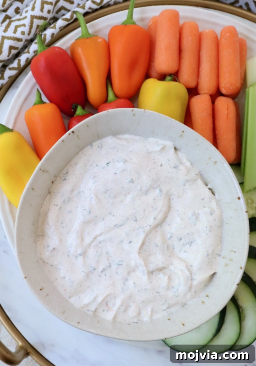 Garden Vegetable Dip 6 creamy vegetable dip in a bowl surrounded by fresh vegetables
