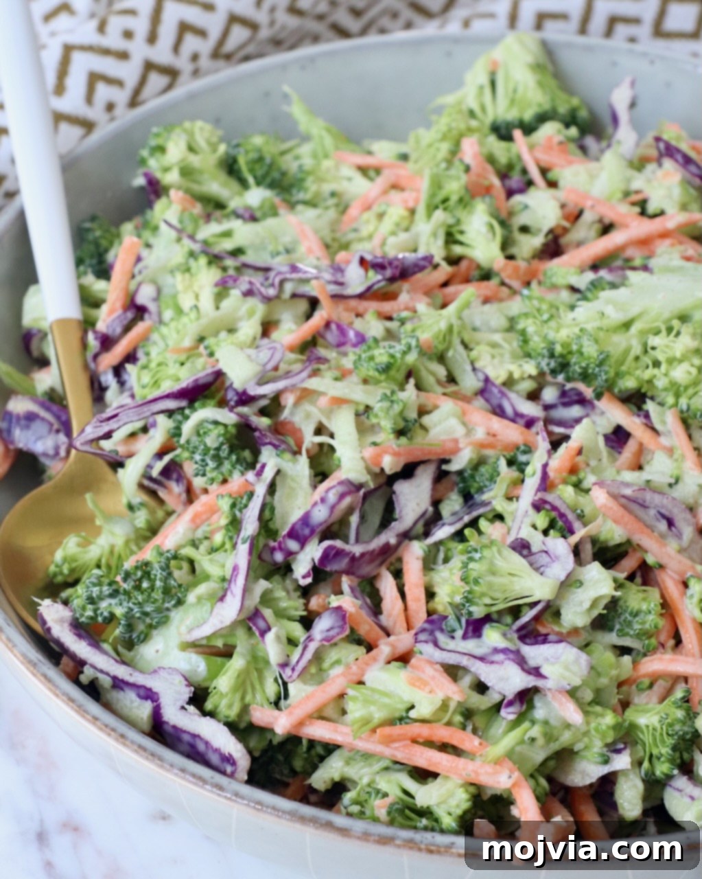Vibrant Broccoli Slaw 10 A generous serving of fresh Broccoli Slaw presented in an elegant bowl, ready for a gathering.