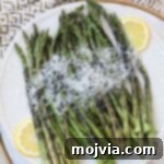 Simple Steps to Delicious Asparagus 15 Grilled asparagus on plate topped with parmesan cheese