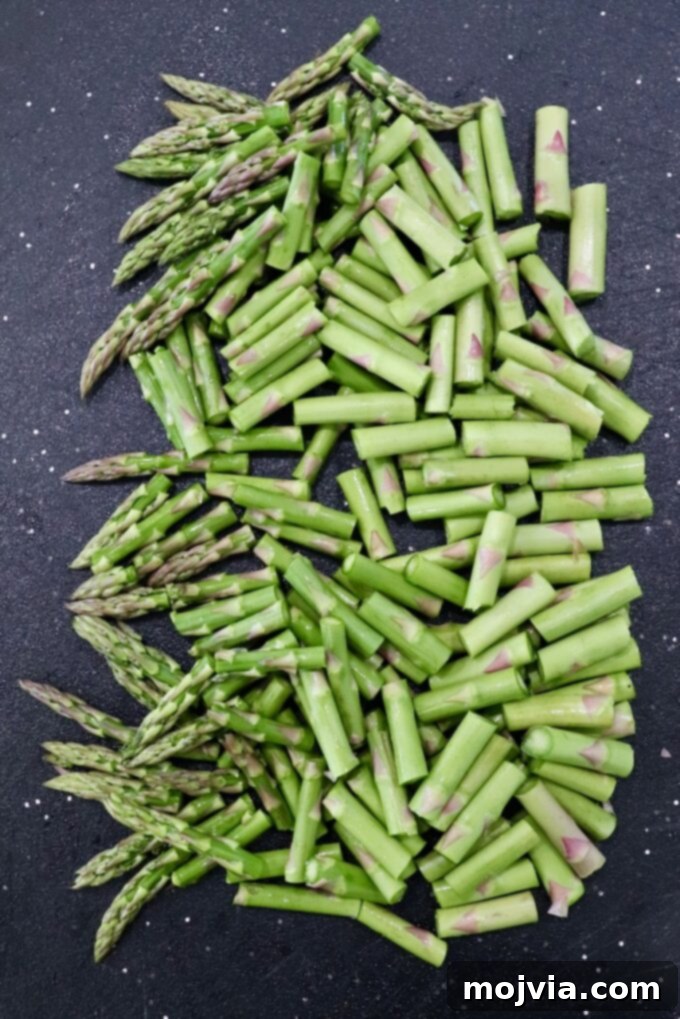 Simple Steps to Delicious Asparagus 9 Diced asparagus pieces on a cutting board, ready for a skillet.