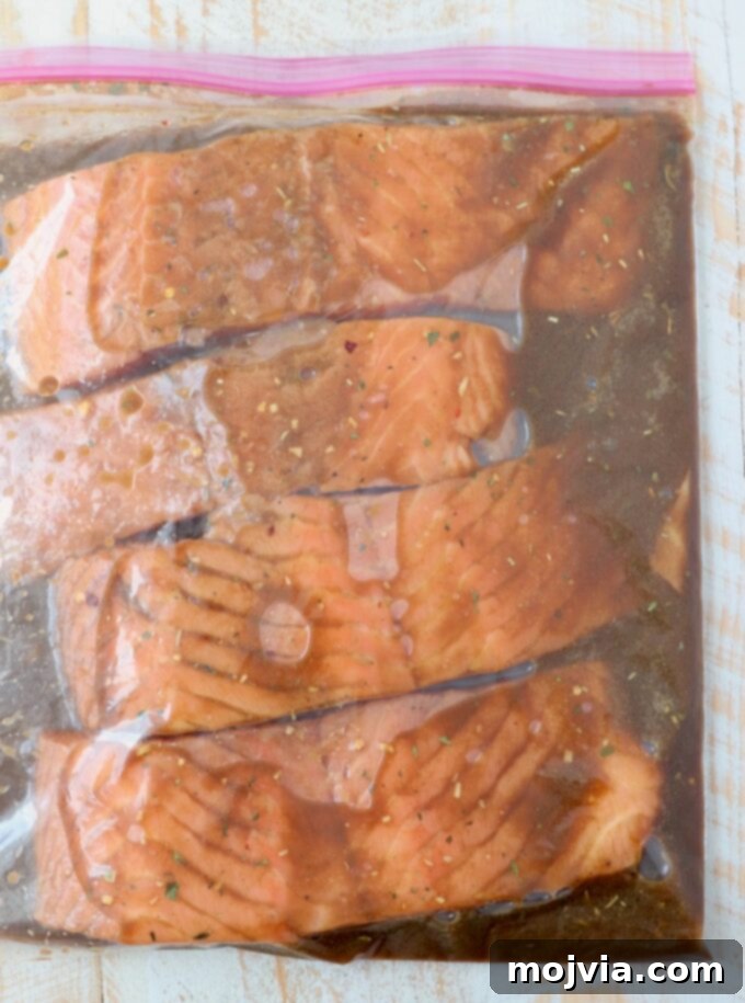 pieces of salmon marinating in a zipper bag