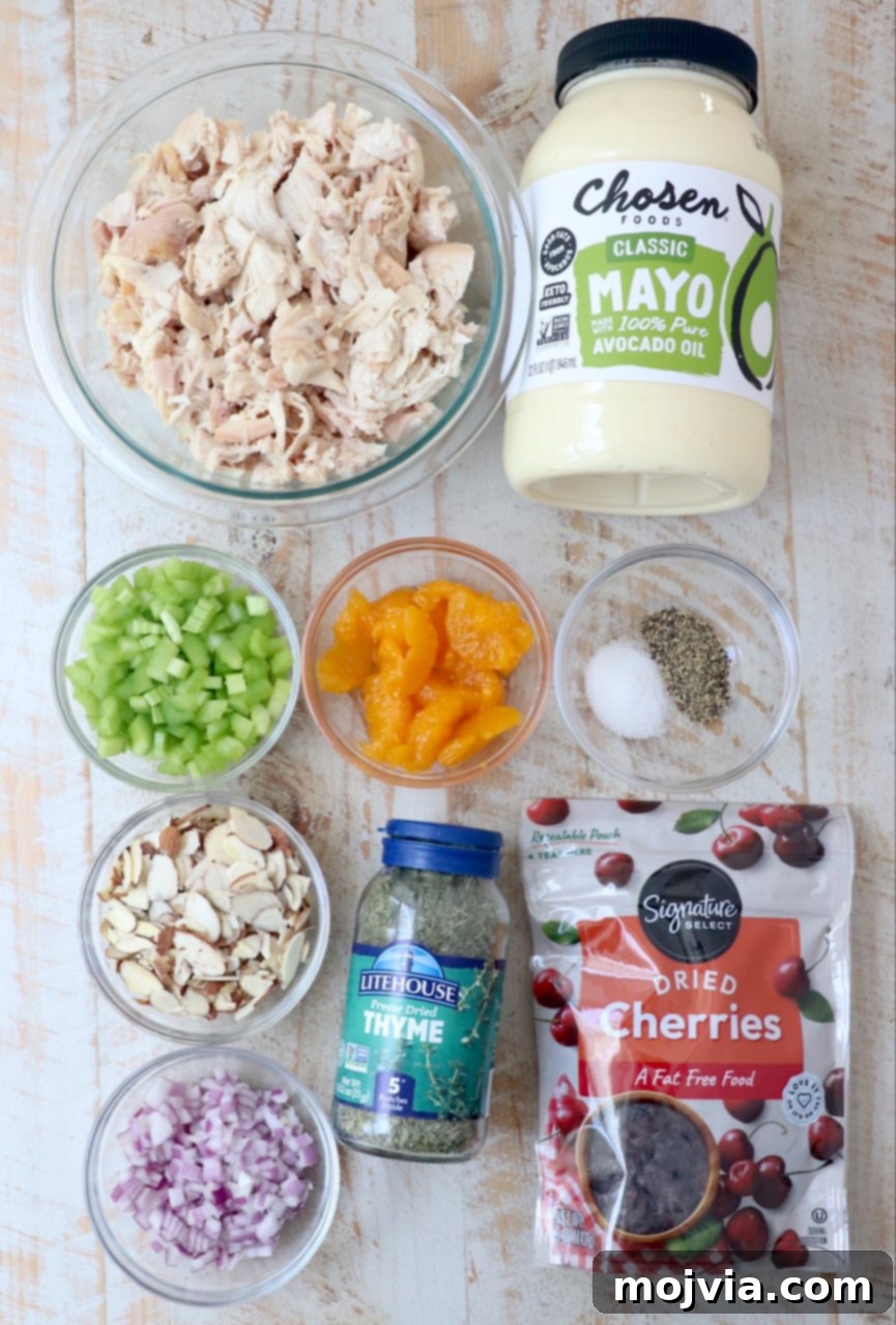 Garden Chicken Medley 3 fresh ingredients for classic chicken salad laid out on a white wooden board