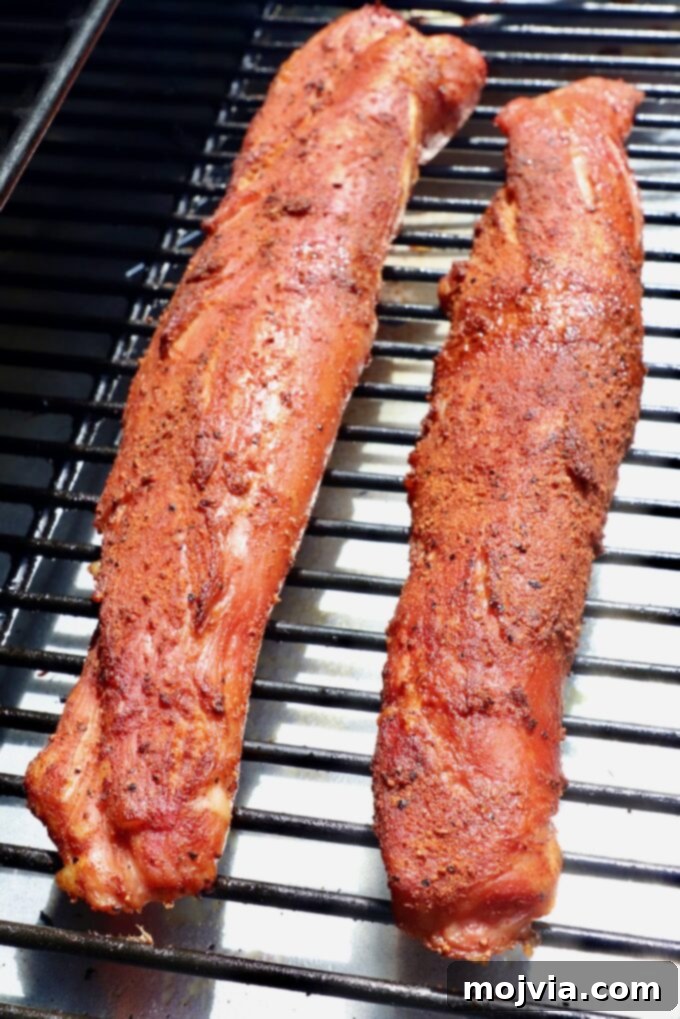 Perfectly Smoked Pork Tenderloin 6 smoked seasoned pork tenderloins on smoker