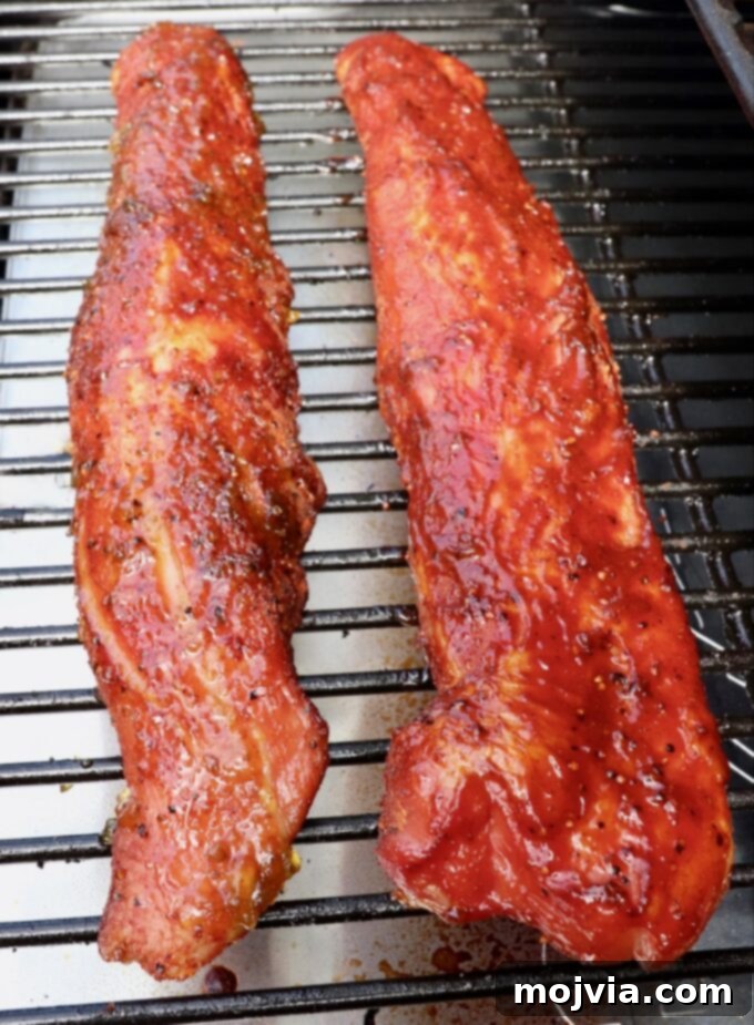 Perfectly Smoked Pork Tenderloin 7 glazed smoked pork tenderloins on smoker