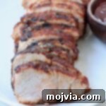 grilled pork tenderloin sliced on plate