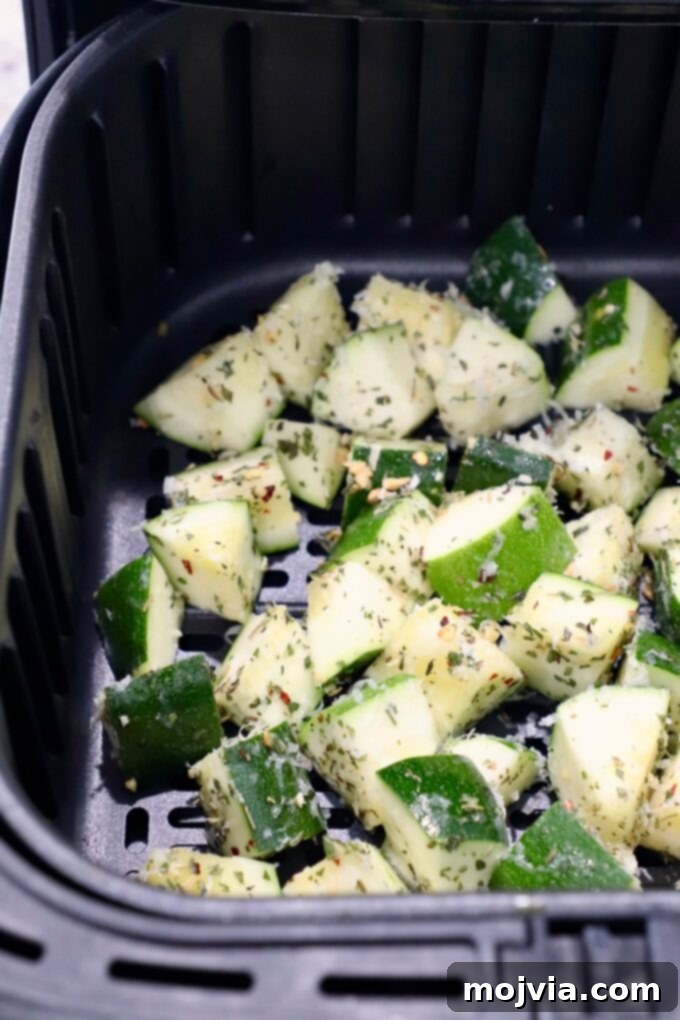 Mastering Zucchini: Your Essential Cooking Guide 13 seasoned diced zucchini in air fryer basket