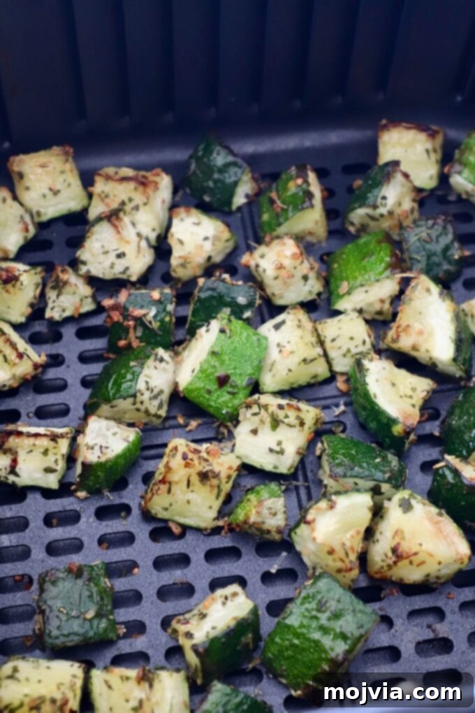 Mastering Zucchini: Your Essential Cooking Guide 14 cooked diced zucchini in air fryer basket