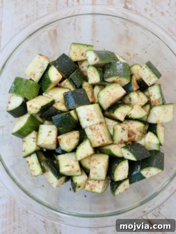 Mastering Zucchini: Your Essential Cooking Guide 6 seasoned diced zucchini in glass bowl