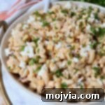 Mexican street corn salad in bowl with spoon
