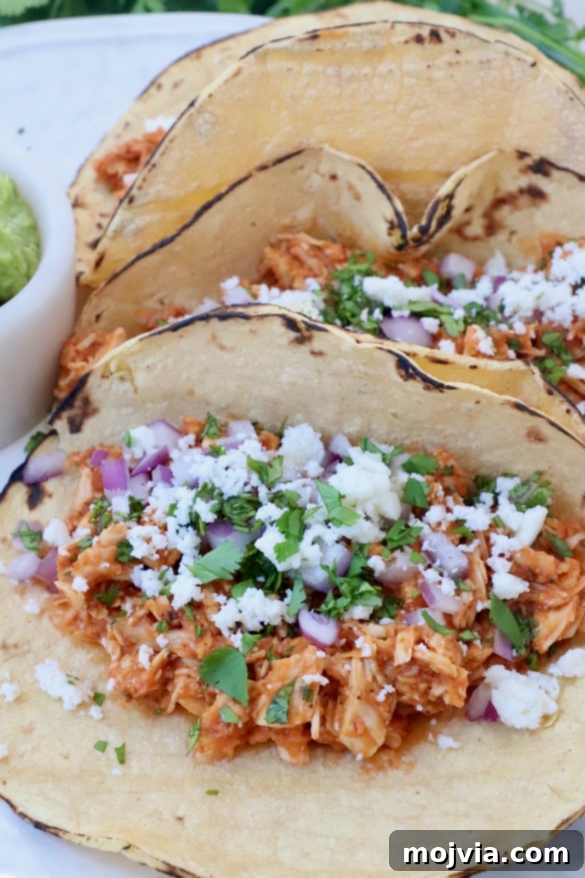 Smoky Chipotle Chicken Tinga 9 chicken tinga tacos on plate