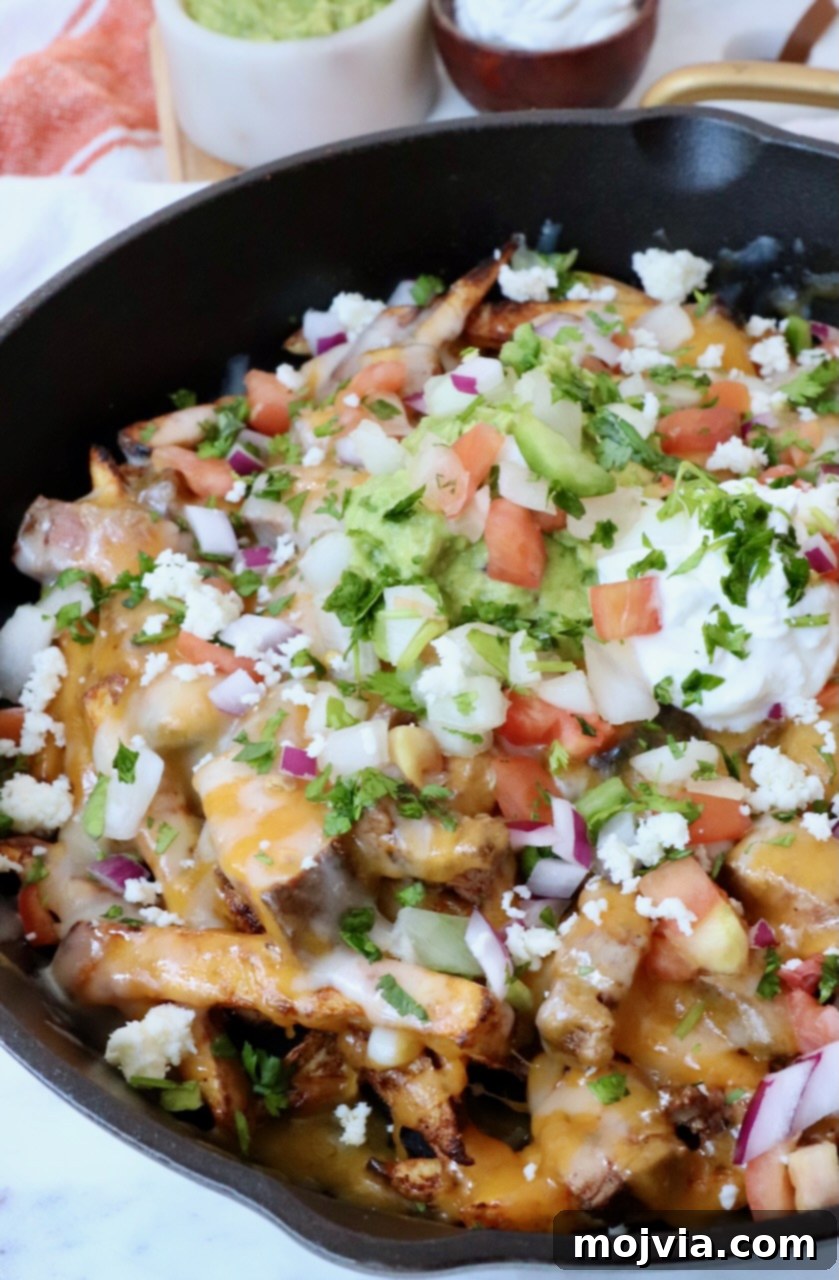 Ultimate Grilled Steak Fries 13 carne asada fries in cast iron skillet