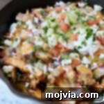 carne asada fries in cast iron skillet