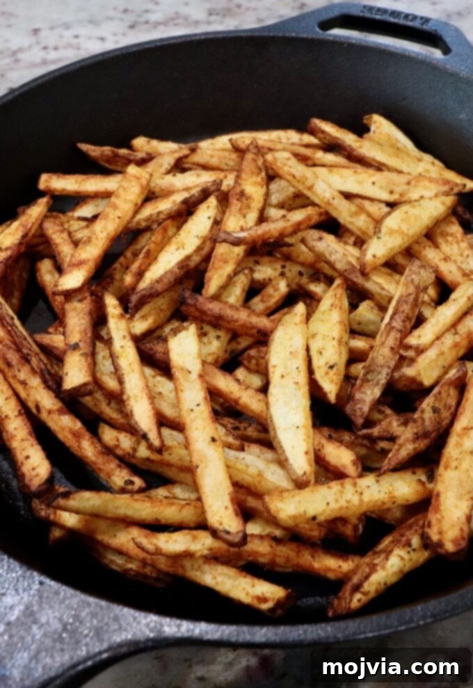 Ultimate Grilled Steak Fries 9 cooked french fries in cast iron skillet