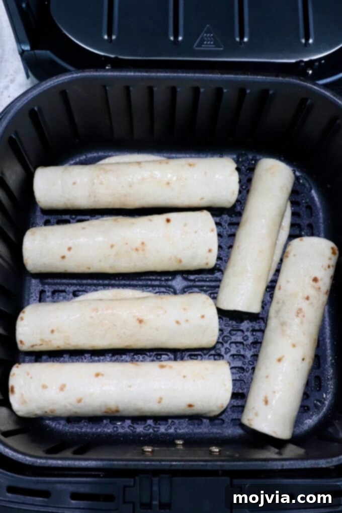 Crispy Beef Taquitos 8 uncooked taquitos in air fryer basket