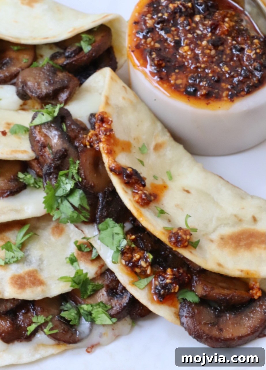 Salsa Macha 8 mushroom tacos on a plate with salsa macha on the side