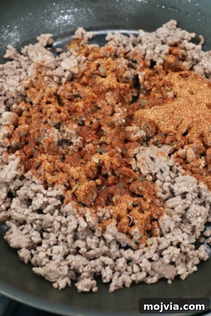 ground beef with taco seasoning in skillet