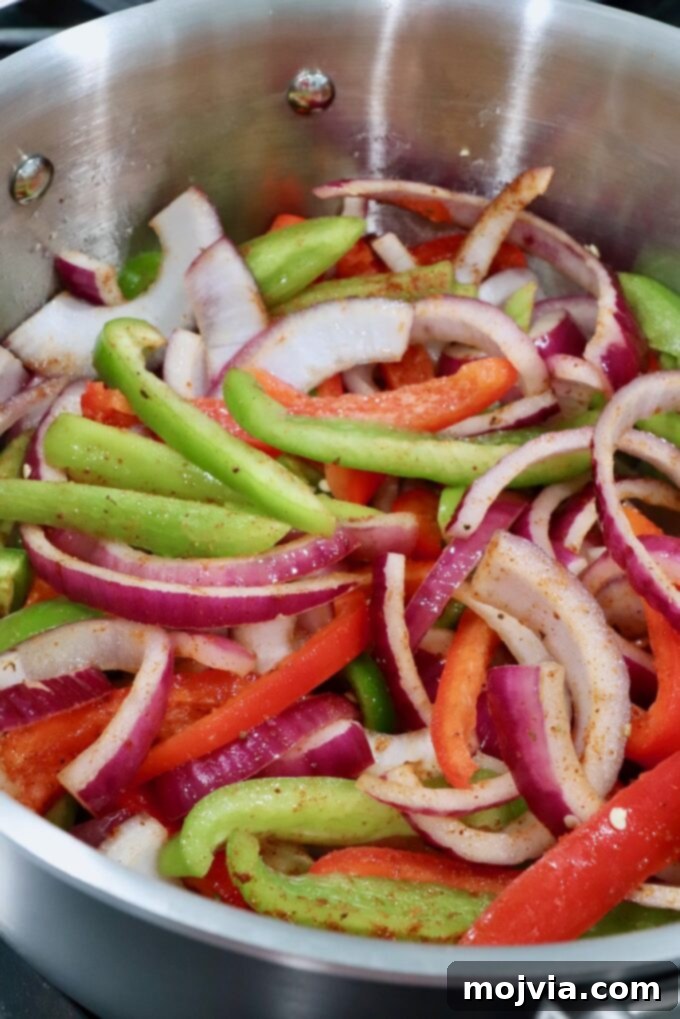 Golden Grilled Chicken Quesadillas 5 sliced bell peppers and onions in a pot